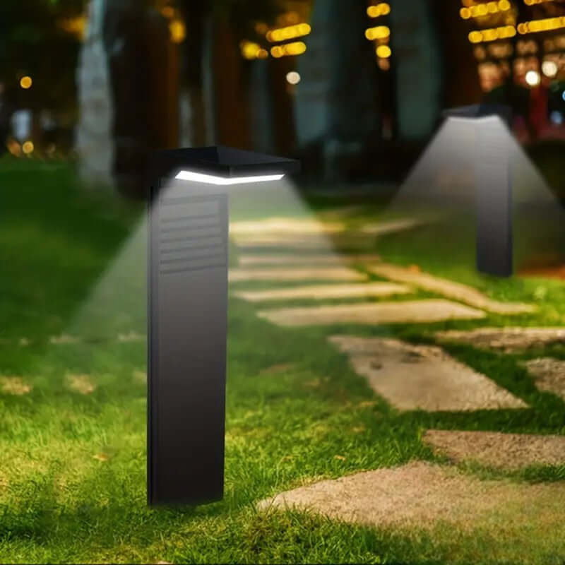 Lampa solarna zewnętrzna w nowoczesnym ogrodzie.