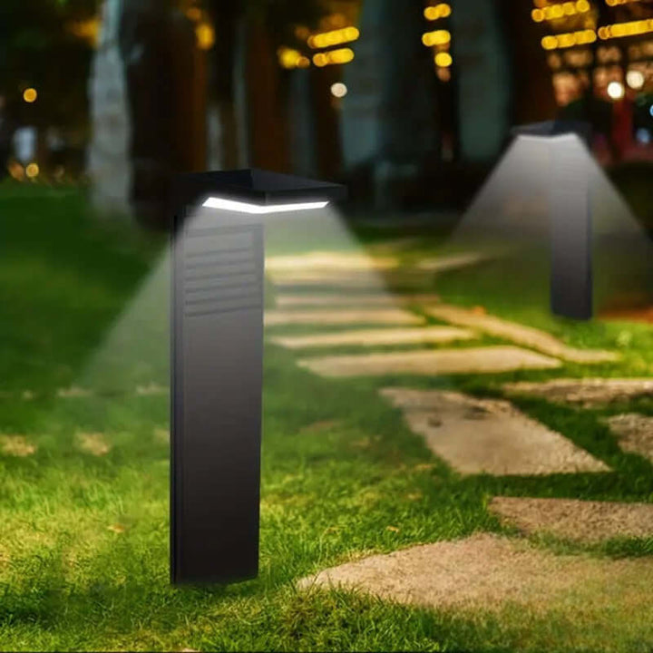 Lampa solarna zewnętrzna w nowoczesnym ogrodzie.