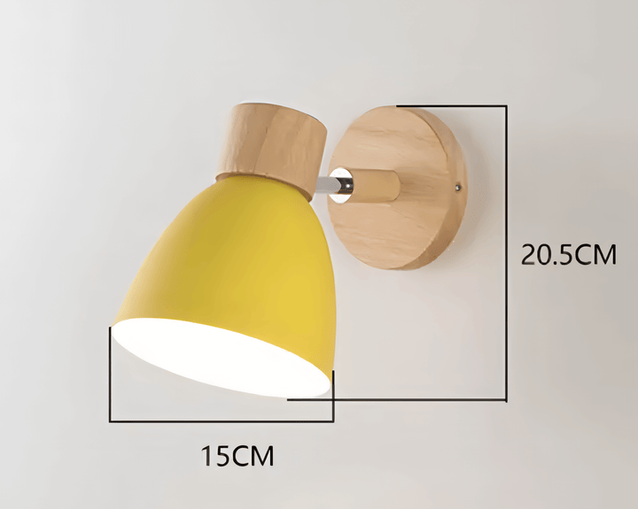 Lampa ścienna w kolorze zielonym na tle szarej ściany