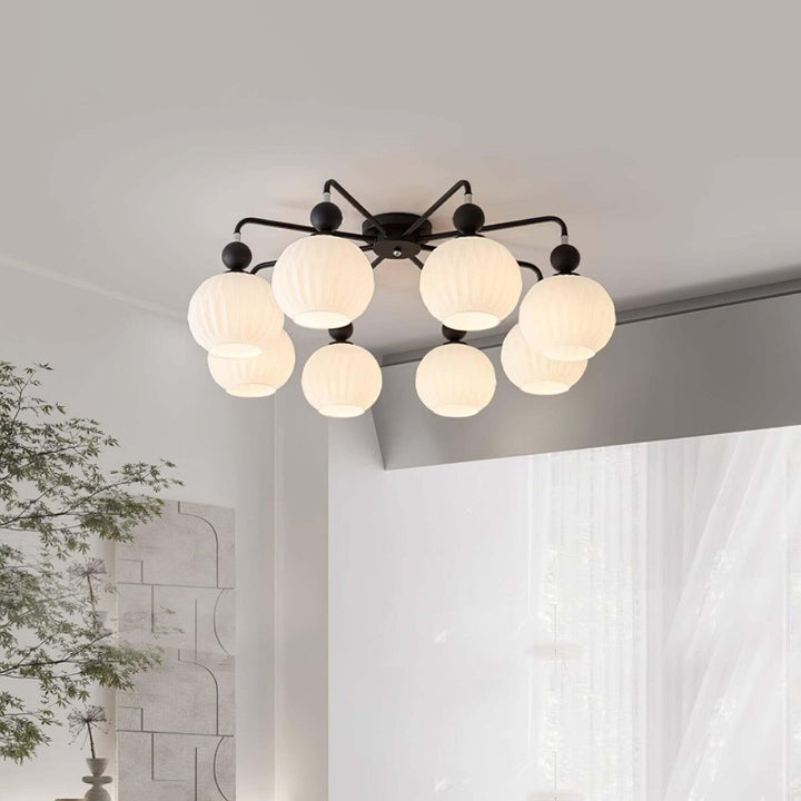 Nowoczesna lampa sufitowa Rylee, zamontowana na suficie w eleganckim salonie