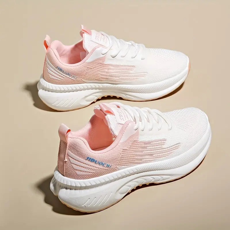 Damskie ortopedyczne buty sportowe w pastelowym różu, lekkie i oddychające, nowoczesny design dla codziennego komfortu i stylu.