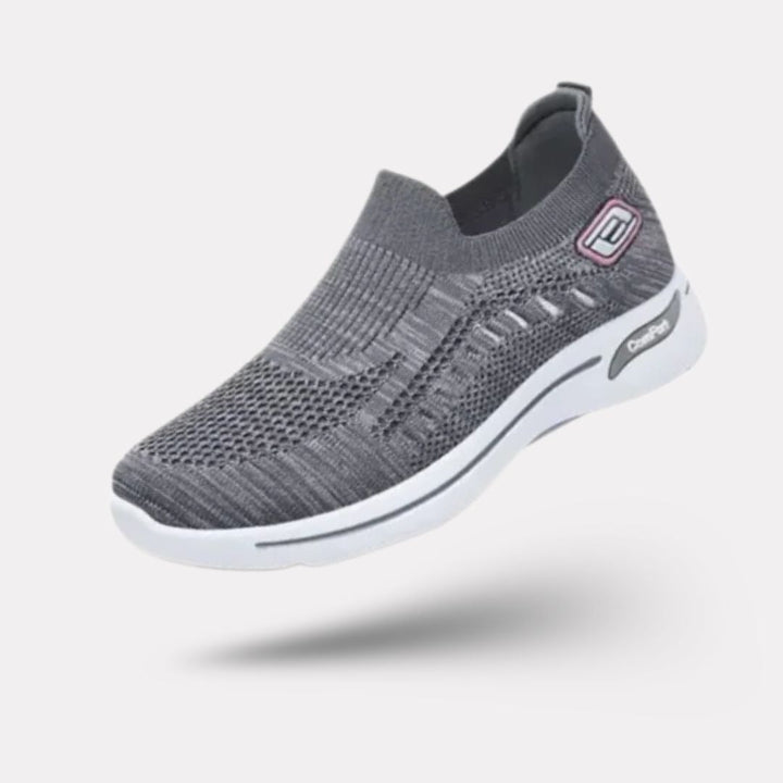 Damskie buty sportowe ortopedyczne w kolorze ciemnoszarym, nowoczesny styl i wygodne podeszwy, elegancki widok z boku.