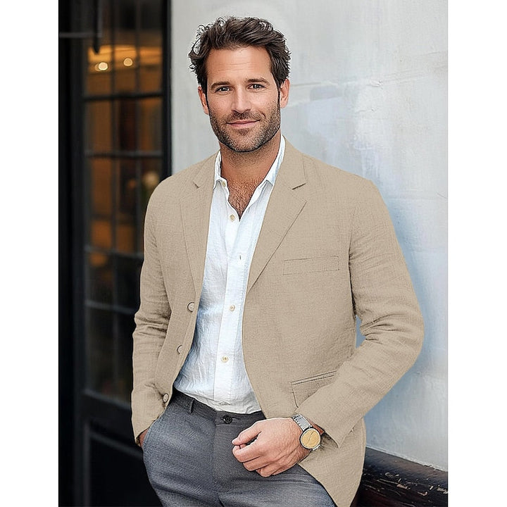 Szykowna męska marynarka w kolorze niebieskim, luźny krój, czarne guziki, dla profesjonalnej i codziennej elegancji.