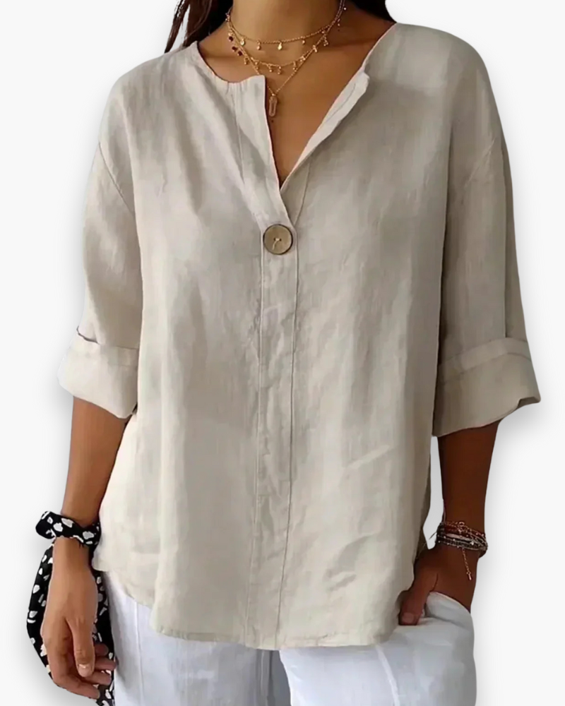 Beżowa, luźna, elegancka bluzka damska, dekolt w kształcie litery V, szykowna i casualowa, idealna na co dzień.