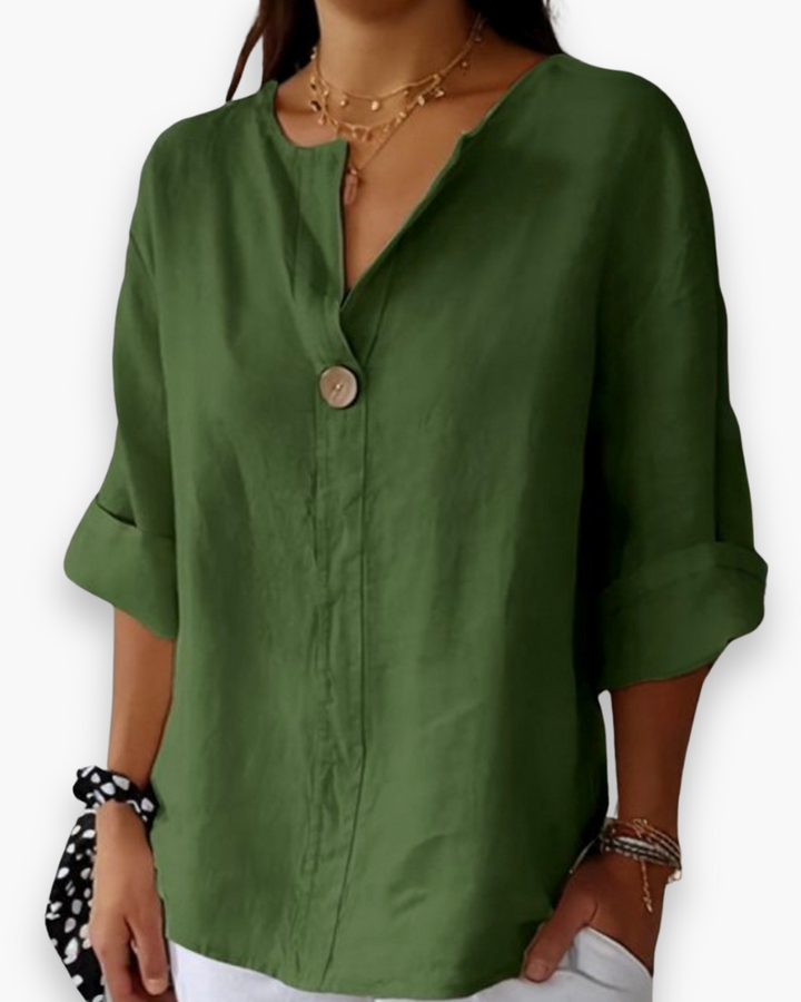 Beżowa, luźna, elegancka bluzka damska, dekolt w kształcie litery V, szykowna i casualowa, idealna na co dzień.