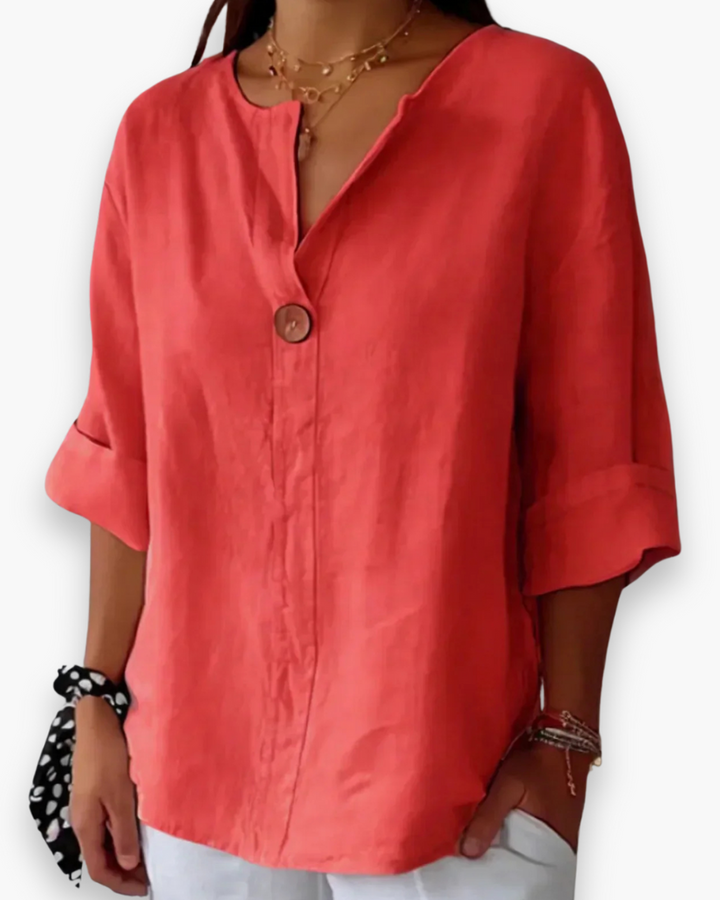 Beżowa, luźna, elegancka bluzka damska, dekolt w kształcie litery V, szykowna i casualowa, idealna na co dzień.