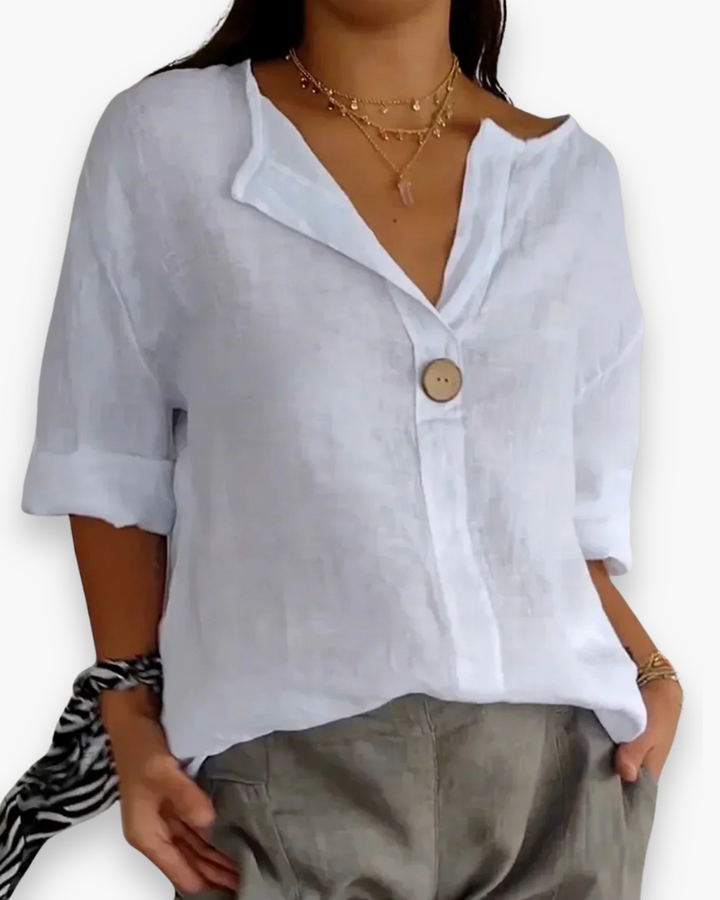 Beżowa, luźna, elegancka bluzka damska, dekolt w kształcie litery V, szykowna i casualowa, idealna na co dzień.