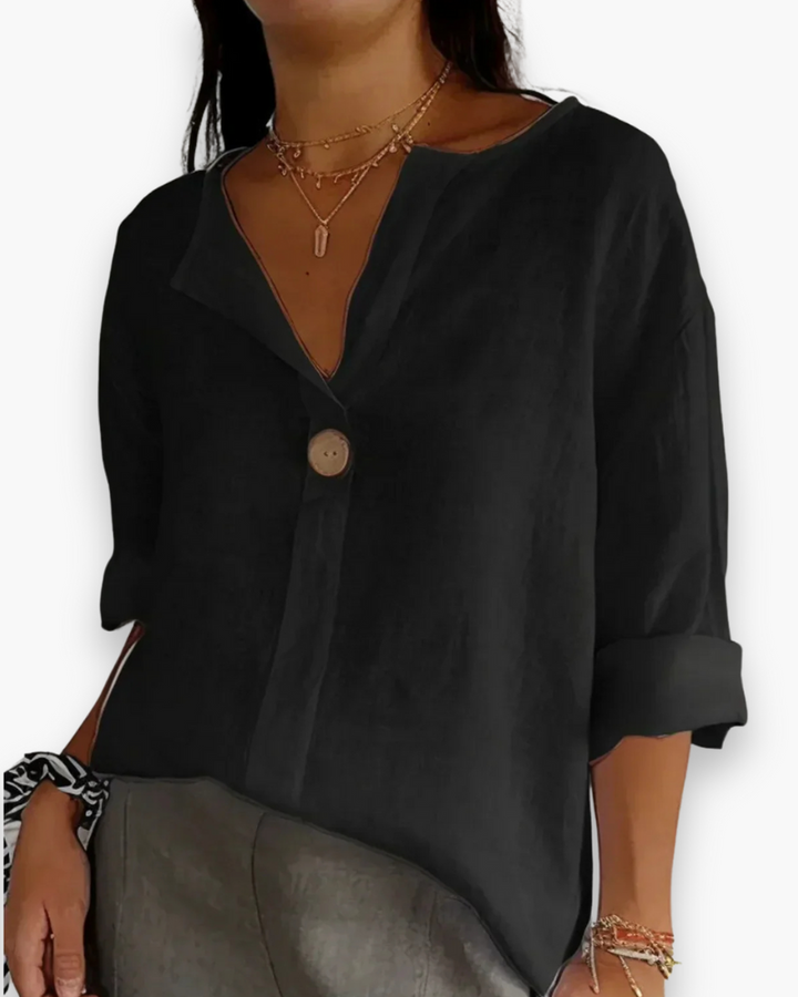 Beżowa, luźna, elegancka bluzka damska, dekolt w kształcie litery V, szykowna i casualowa, idealna na co dzień.