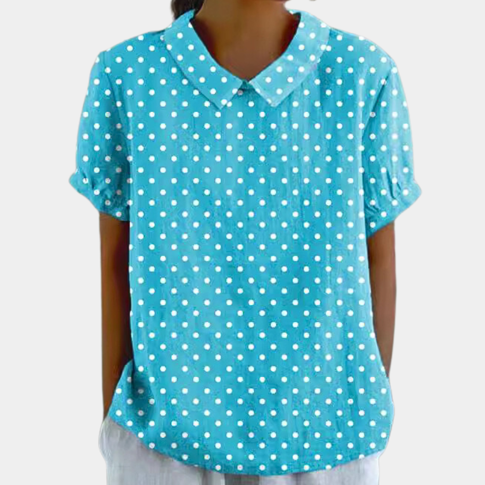 Bluzka damska w pastelowe kwiaty, okrągły dekolt, kolor zielony. Elegancka i wygodna, idealna na co dzień.