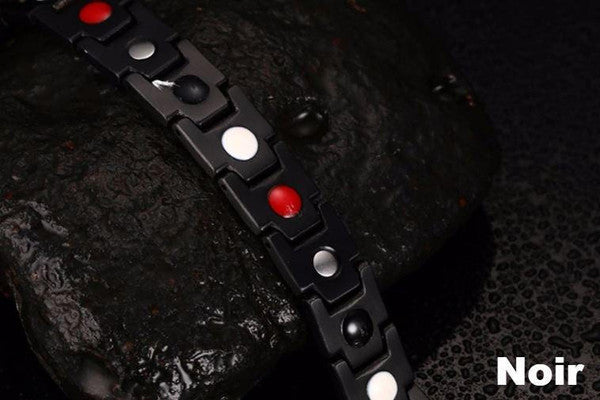 Elegancka bransoletka magnetyczna w kolorze czarnym i srebrnym, z kamieniami ochry, oferująca równowagę energetyczną i korzyści terapeutyczne.