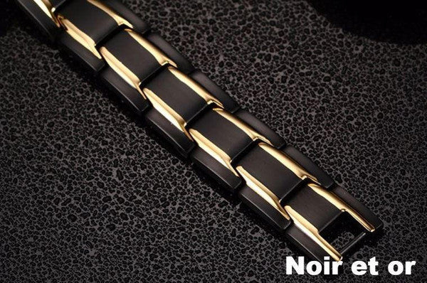 Elegancka bransoletka magnetyczna w kolorze czarnym i srebrnym, z kamieniami ochry, oferująca równowagę energetyczną i korzyści terapeutyczne.