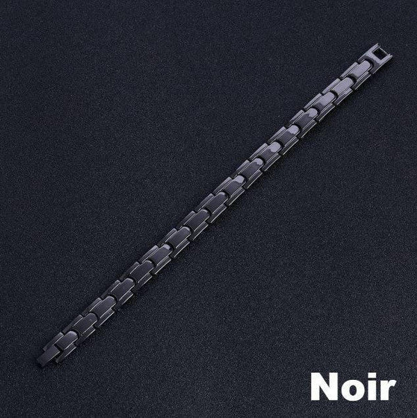 Elegancka bransoletka magnetyczna w kolorze czarnym i srebrnym, z kamieniami ochry, oferująca równowagę energetyczną i korzyści terapeutyczne.