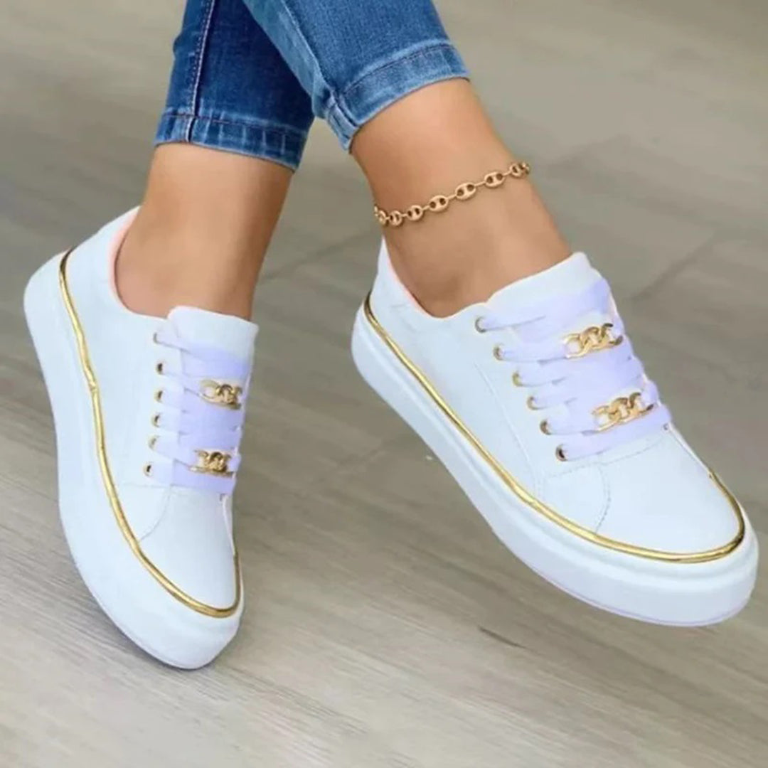 Białe damskie buty sportowe Nina, nowoczesny design, elegancja i komfort, idealne do miejskiego i aktywnego stylu.