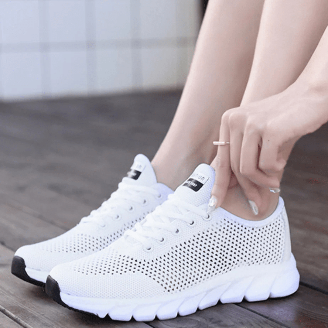 Nowoczesne, oddychające, eleganckie buty ortopedyczne dla kobiet, widok z przodu, dostępne w kolorach białym, czarnym i różowym, zapewniające komfort i styl.
