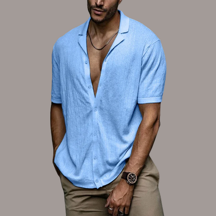 Biała męska koszula lniana, z guzikami i klasycznym kołnierzykiem, oddychająca i elegancka na lato. Dostępna w wielu kolorach.