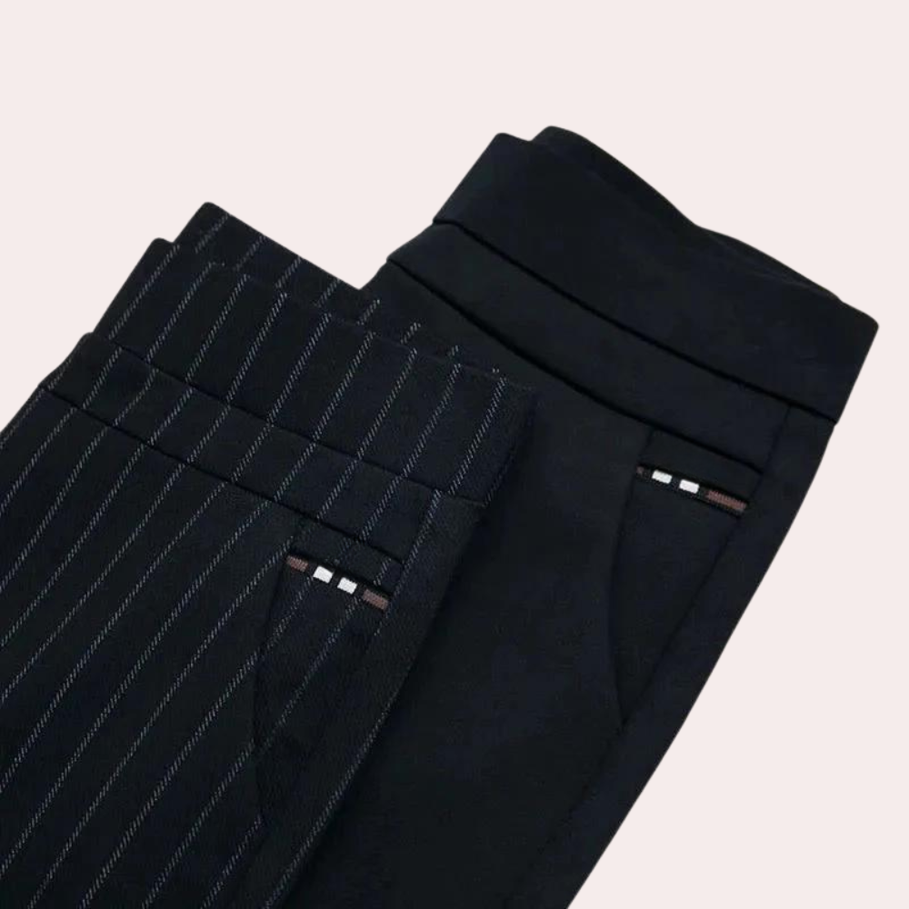 Spodnie damskie modelujące typu slim fit z wysokim stanem. Czarne, elastyczne i wygodne, podkreślające figurę.