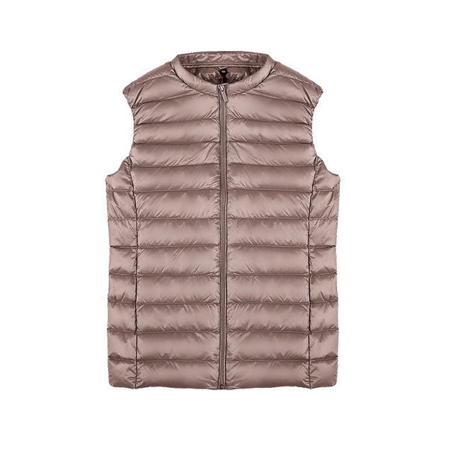 Ultralekka kamizelka puchowa damska, elegancki design, kompaktowa, wodoodporna, idealna na każdą pogodę.