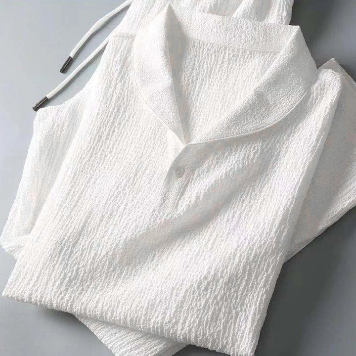 Męski zestaw lniany, biała koszula i czarne spodnie, luźny i elegancki krój, idealny na co dzień.