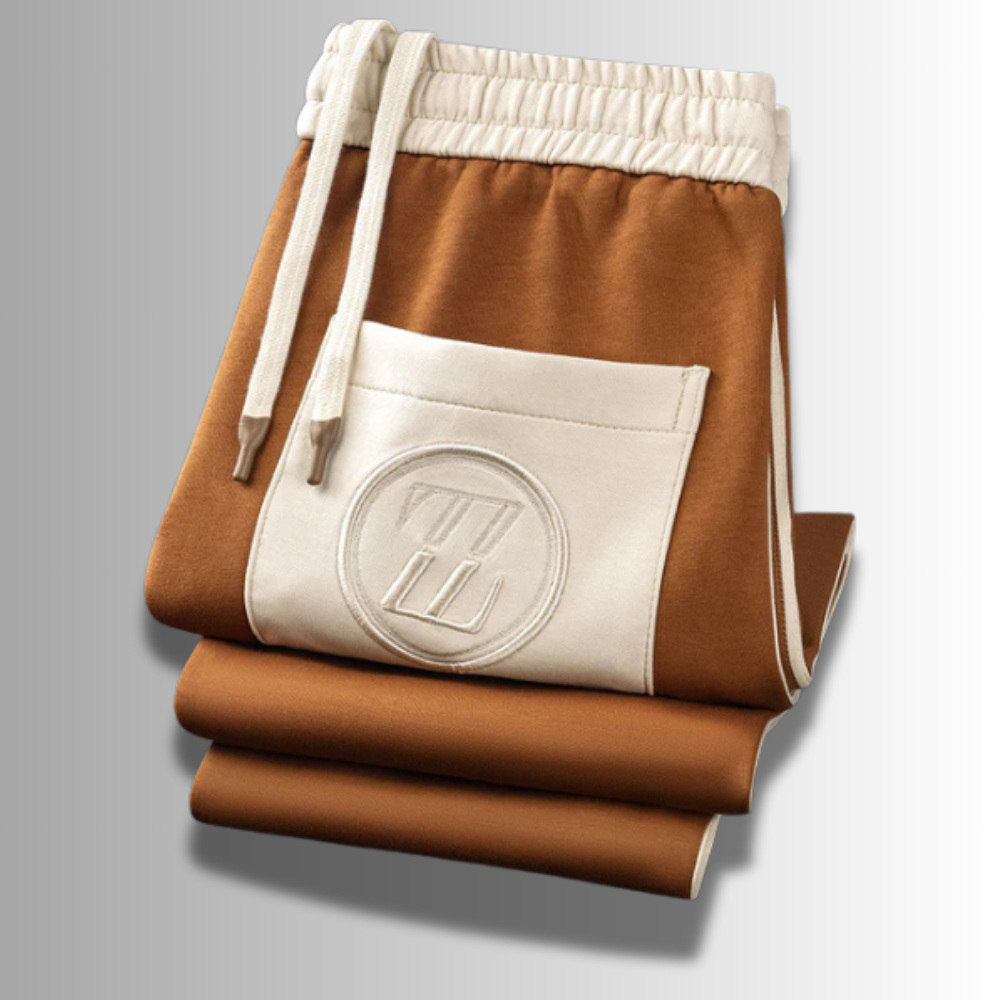 Elegancki męski zestaw dresowy, nowoczesny krój, ciemny kolor, oddychający materiał, idealny do sportu i relaksu.