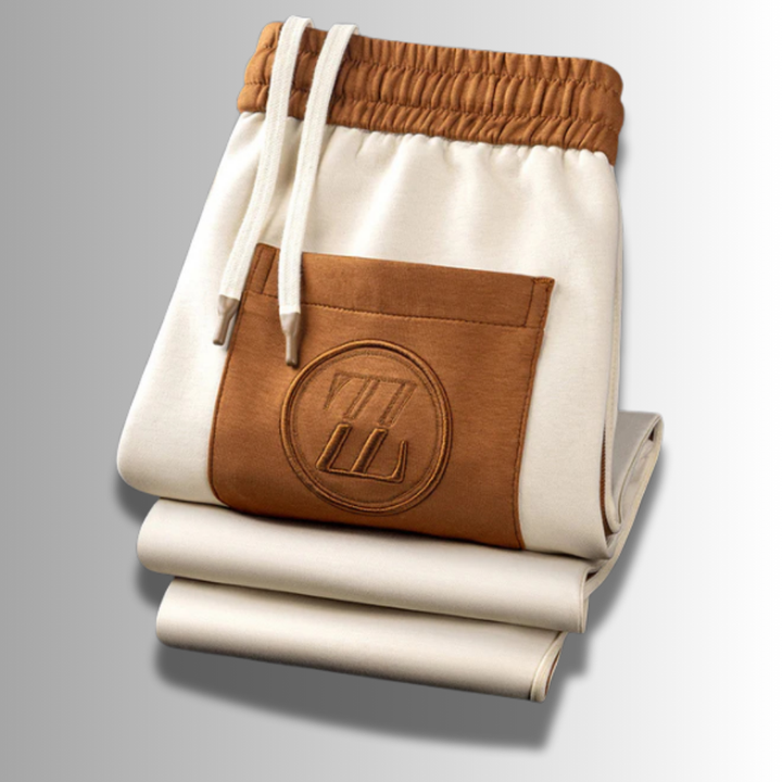 Elegancki męski zestaw dresowy, nowoczesny krój, ciemny kolor, oddychający materiał, idealny do sportu i relaksu.