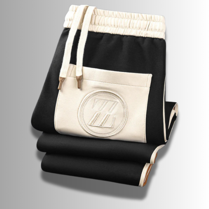 Elegancki męski zestaw dresowy, nowoczesny krój, ciemny kolor, oddychający materiał, idealny do sportu i relaksu.