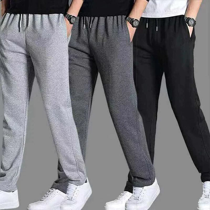 Czarne joggery męskie w miejskim stylu, z wąskimi nogawkami i praktycznymi kieszeniami na zamek.