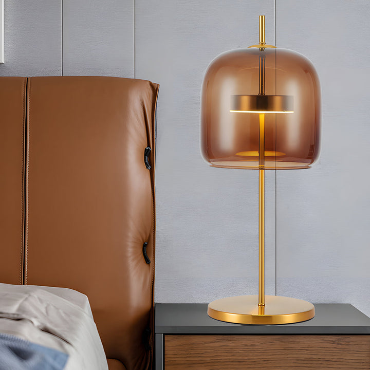 Lampa stołowa z przydymionego szkła, nowoczesny design, miękkie światło, idealna do wystroju wnętrz, ciepła atmosfera.