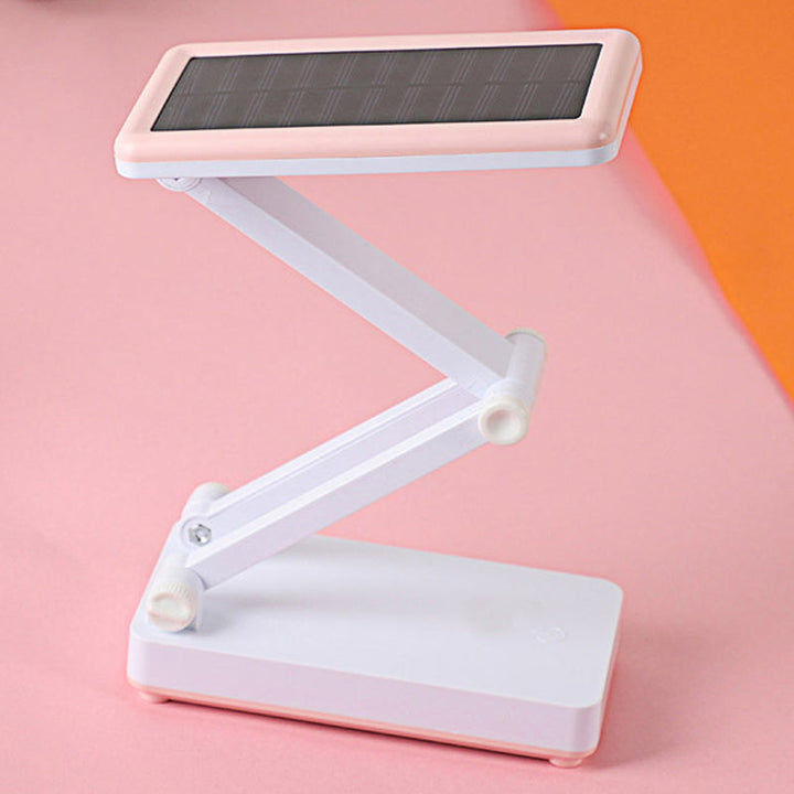 Składana lampa LED solarna, kompaktowa konstrukcja, w kolorach białym, różowym, zielonym do wnętrz i na zewnątrz.