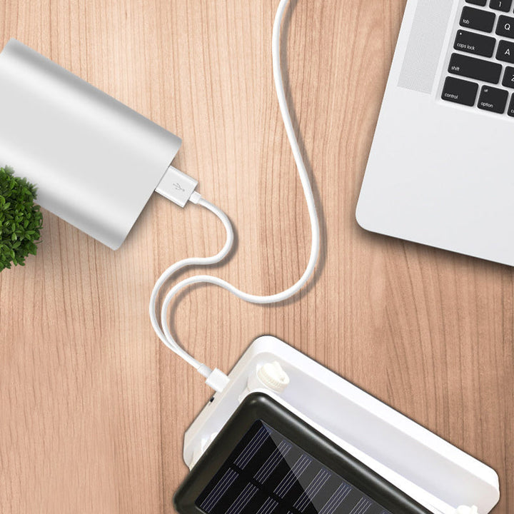 Składana lampa LED solarna, kompaktowa konstrukcja, w kolorach białym, różowym, zielonym do wnętrz i na zewnątrz.