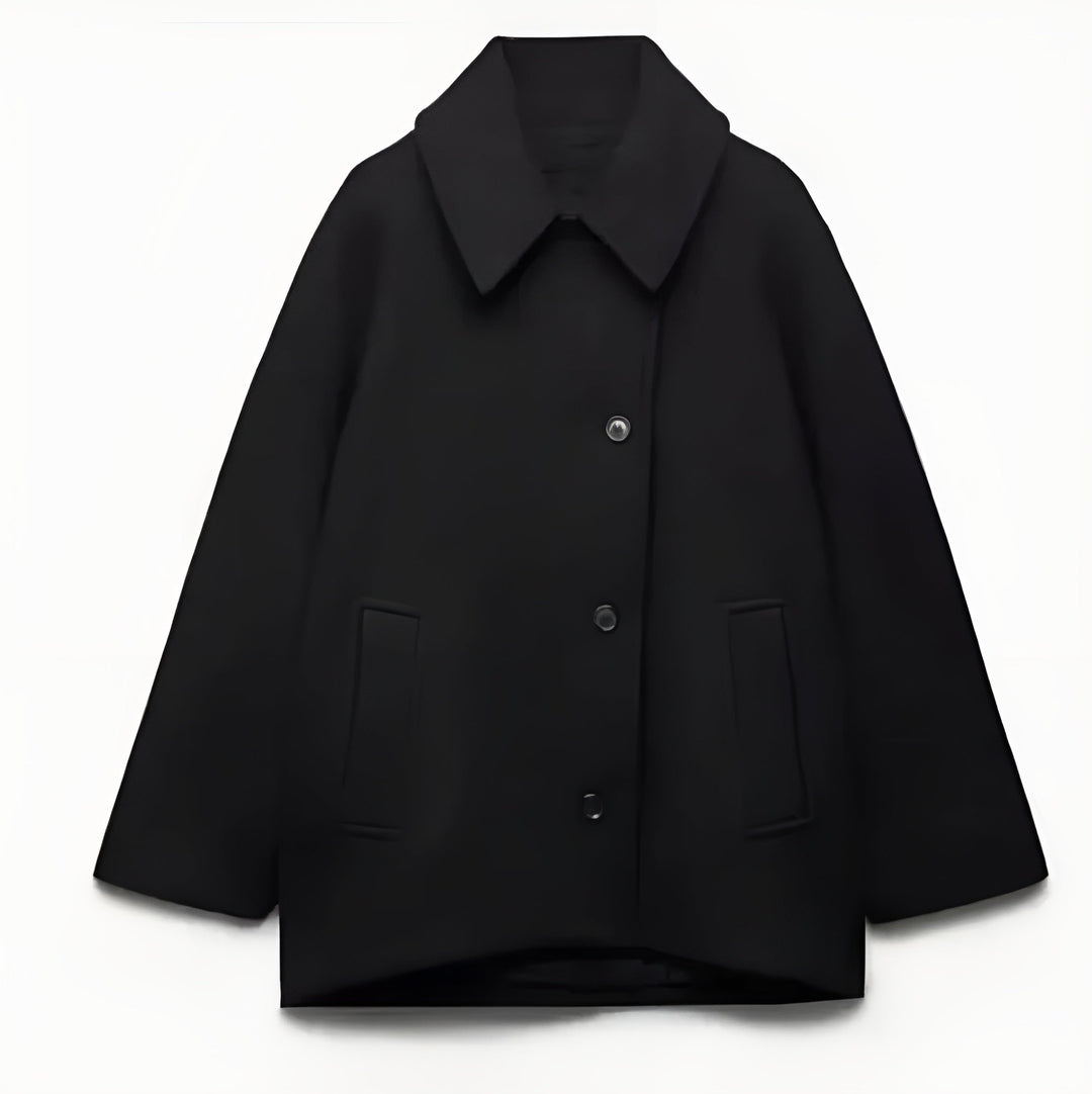 Elegancki, oversize'owy płaszcz wełniany, idealny na zimę, zapewniający komfort i styl.