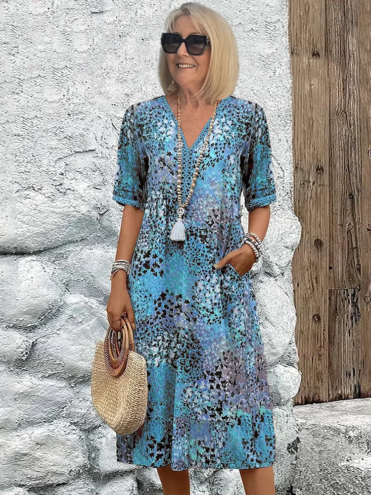 Elegancka, a zarazem swobodna sukienka midi damska. Miękki materiał, dekolt V. Idealna na wiosenne i letnie dni.