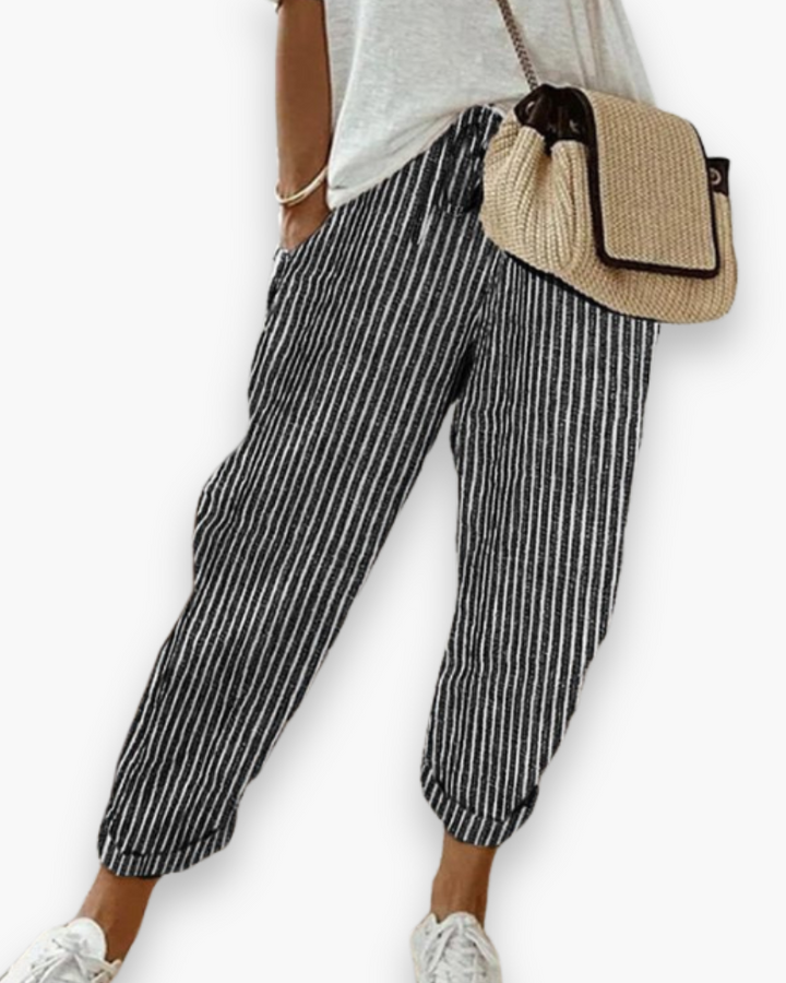 Szerokie spodnie damskie, lekka tkanina, nowoczesny styl, dyskretne kieszenie, elastyczny pas, elegancki krój, optymalny komfort