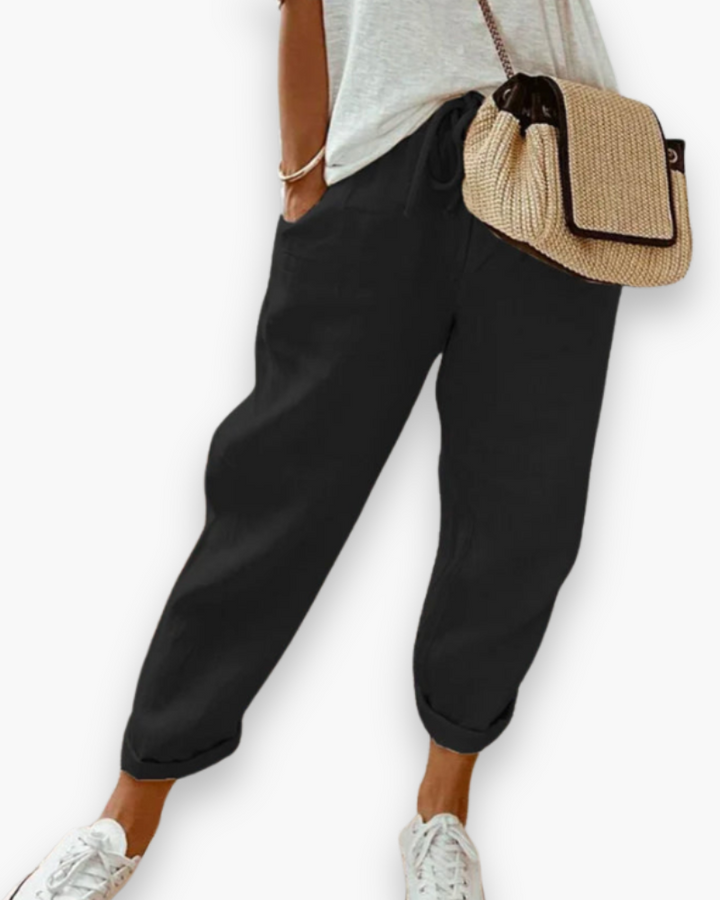 Szerokie spodnie damskie, lekka tkanina, nowoczesny styl, dyskretne kieszenie, elastyczny pas, elegancki krój, optymalny komfort