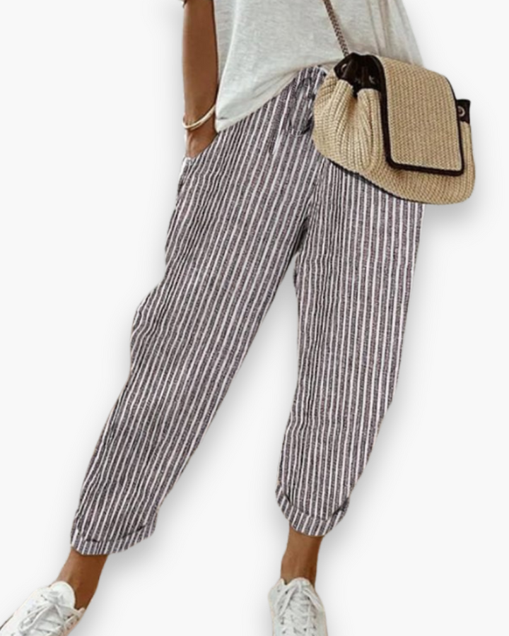 Szerokie spodnie damskie, lekka tkanina, nowoczesny styl, dyskretne kieszenie, elastyczny pas, elegancki krój, optymalny komfort