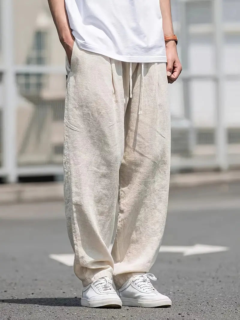 Męskie lniane spodnie typu wide leg, lekkie, oddychające, nowoczesny design zapewniający letni komfort, elegancki styl casualowy