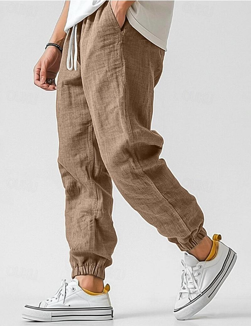 Męskie białe spodnie lniane, lekkie i oddychające, w stylu casual na lato, zapewniające komfort i elegancję.