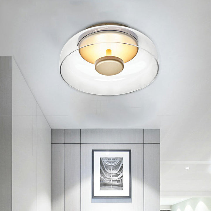 Nowoczesna lampa sufitowa LED ze szkła dymionego, elegancki kształt, ciepłe światło, idealna do przedpokoju lub salonu.