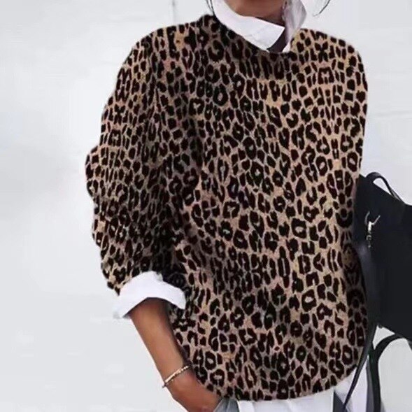 Elegancki sweter damski z delikatnym kwiatowym wzorem, wykonany z mieszanki bawełny, zapewniający komfortowy i pochlebny wygląd.