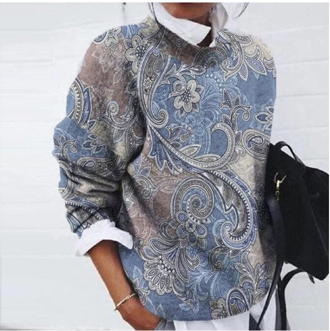 Elegancki sweter damski z delikatnym kwiatowym wzorem, wykonany z mieszanki bawełny, zapewniający komfortowy i pochlebny wygląd.