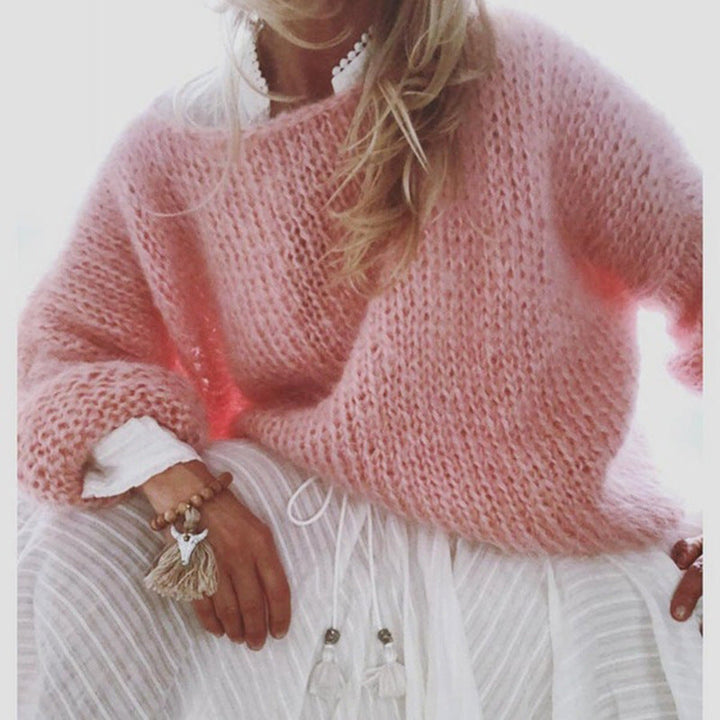 Miękki sweter damski z dzianiny, okrągły dekolt, długie rękawy, dopasowany krój, modny kolor dla eleganckiego i wygodnego stylu.