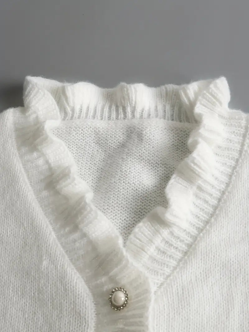 Wiosenny sweter damski z dekoltem V, bawełniany, w kolorze białym, elegancki, lekki i dopasowany, idealny do casualowych lub eleganckich stylizacji.