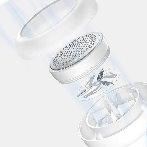 Akumulatorowa golarka do tkanin w kolorze białym i zielonym, kompaktowa, idealna do usuwania kulek i sierści zwierząt z ubrań.