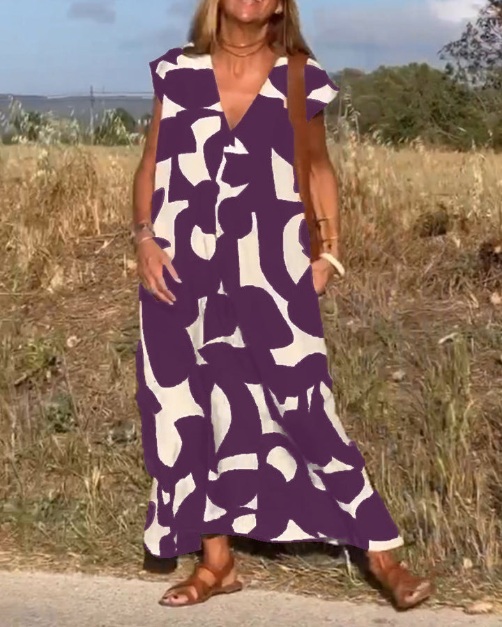 Sukienka Camille z eleganckim wzorem i dekoltem V, widok z przodu, kobieca, modna sukienka dla kobiet, miękki i oddychający materiał.