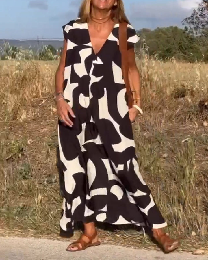 Sukienka Camille z eleganckim wzorem i dekoltem V, widok z przodu, kobieca, modna sukienka dla kobiet, miękki i oddychający materiał.