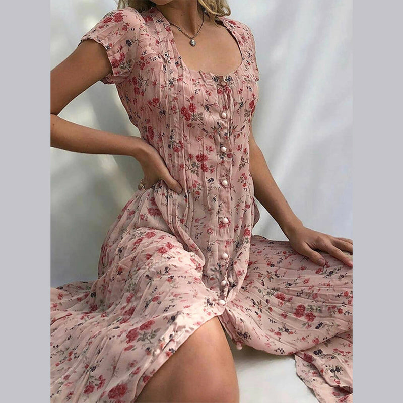 Elegancka i zwiewna letnia kwiecista sukienka Elvira, uroczy nadruk kwiatowy, płynny i pochlebny krój idealny na lato.