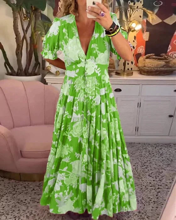 Damska elegancka zwiewna sukienka Juliette z lekkiego materiału, dekolt w serek, taliowana, idealna na każdą okazję.