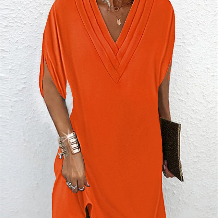 Elegancka sukienka Jansen z rozciętymi rękawami, nowoczesny styl, rozmiary 2XL-3XL, miękka tkanina i wyrafinowany design, idealna na różne okazje