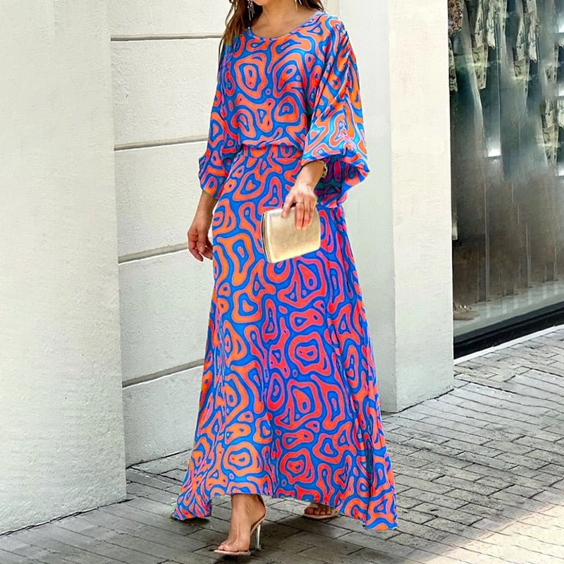Elegancka letnia sukienka midi damska, lekki materiał, stylowy krój, żywy kolor, idealna na upalne dni, komfort i wyrafinowanie.