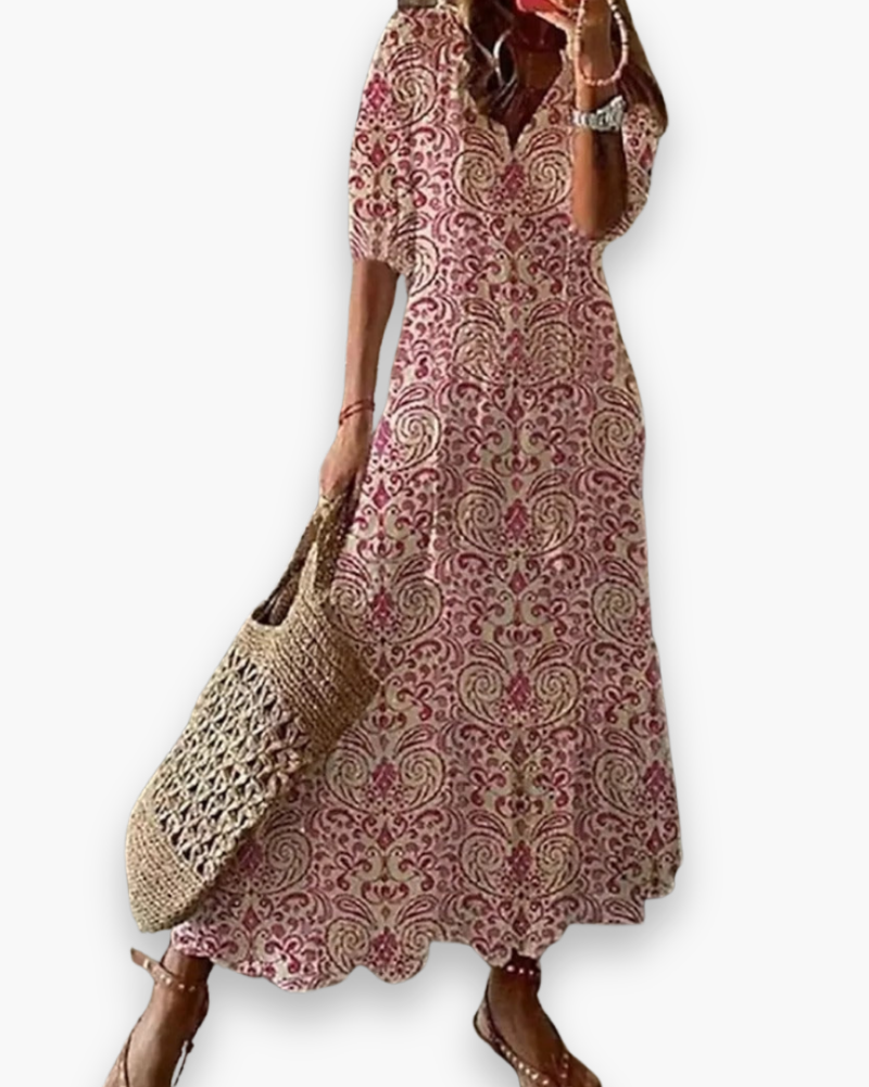 Długa damska sukienka boho, kwiatowy nadruk, elegancka i zwiewna na lato, luźny krój, romantyczny swobodny styl.
