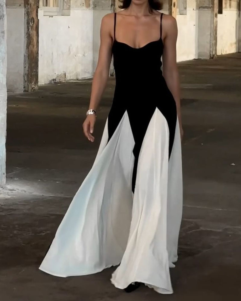 Elegancka długa sukienka czarno-biała z wiskozy z cienkimi ramiączkami dla kobiet, nowoczesny i płynny kontrast.